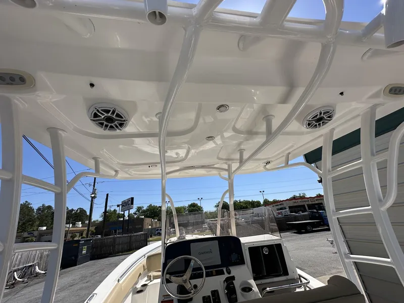 Slide: The Image of 2017 Sea Hunt Edge 24 boat interior with speakers and steering console. - 5