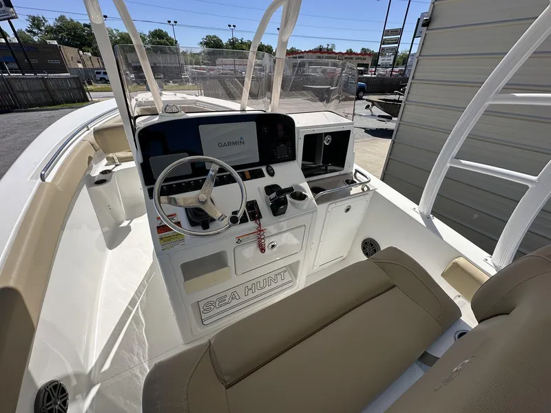 Slide: The Image of 2017 Sea Hunt Edge 24 boat cockpit with Garmin navigation system and steering wheel. - 6