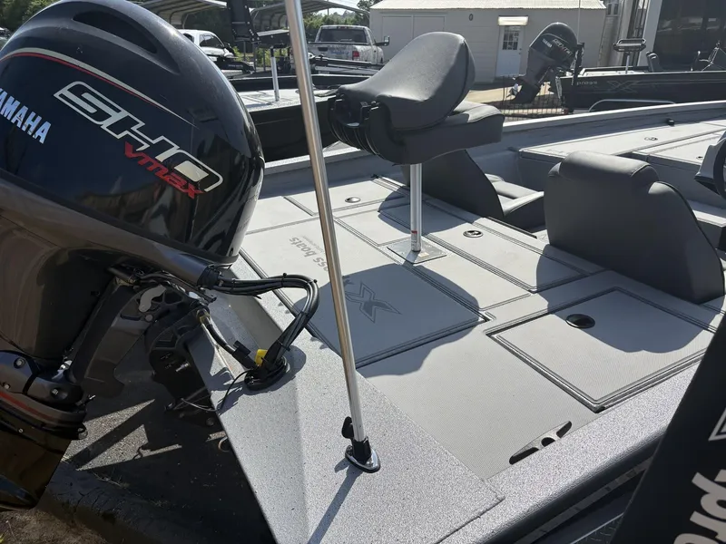 Slide: The Image of 2025 Xpress Hyper-Lift Bass Series boat with Yamaha SHO VMAX engine, featuring sleek deck design. - 4