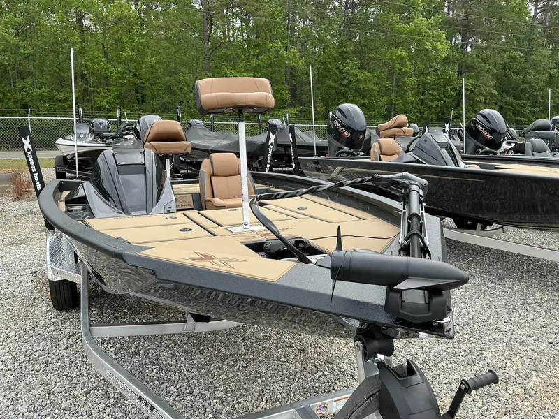 Slide: The Image of 2025 Xpress Hyper-Lift Bass Series boat on display, featuring sleek design and modern seating. - 2