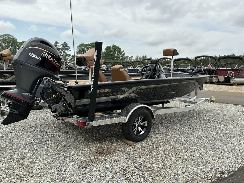 Slide: The Image of 2025 Xpress Hyper-Lift Bass Series boat with Yamaha engine on a trailer. - 5