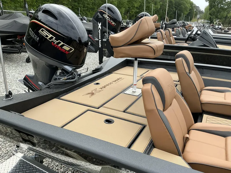 Slide: The Image of 2025 Xpress Hyper-Lift Bass Series boat with Yamaha engine and tan seating. - 6