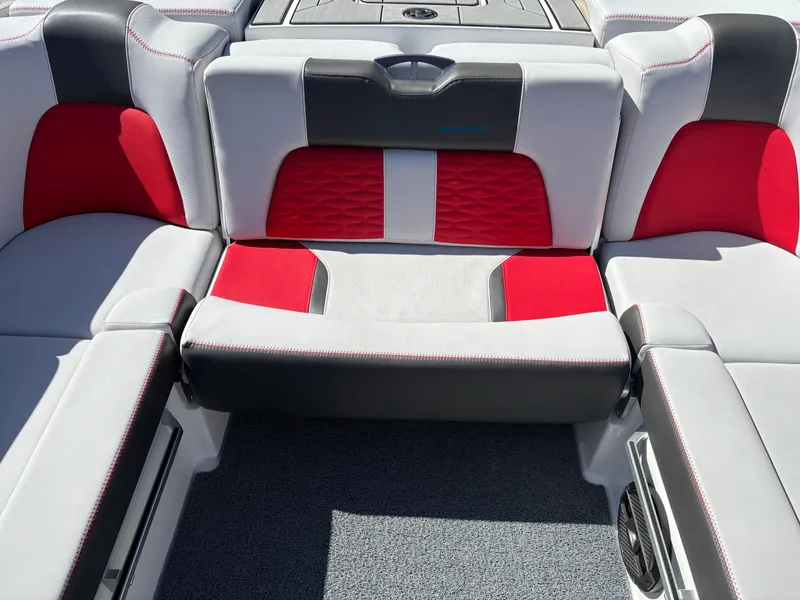 Slide: The Image of 2020 MasterCraft X24 boat interior with red and gray seating. - 12