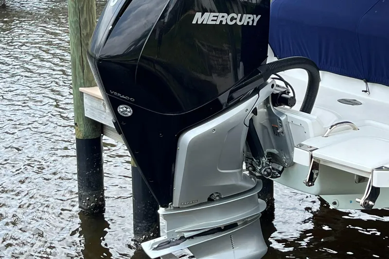 Slide: The Image of 2020 Cobalt 25SC boat with Mercury outboard motor on water. - 10