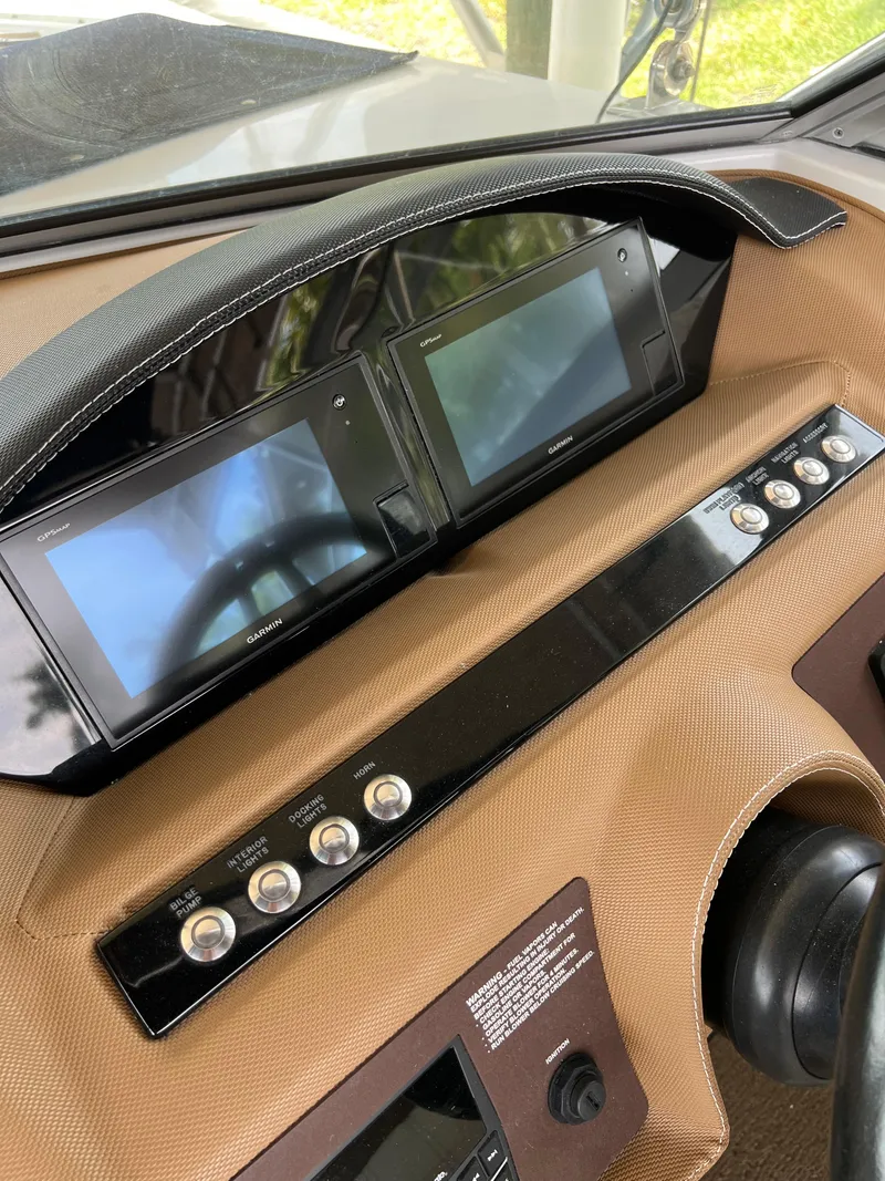 Slide: The Image of 2020 Cobalt 25SC dashboard with dual screens and control buttons. - 13