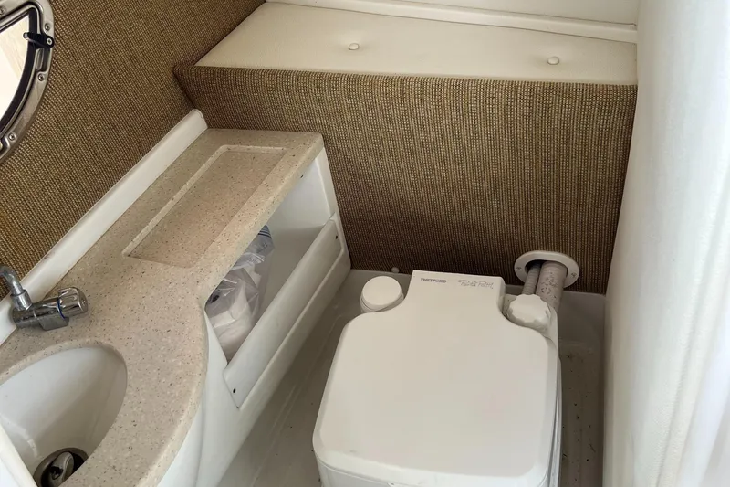 Slide: The Image of Compact bathroom in 2020 Cobalt 25SC boat with sink and portable toilet. - 29
