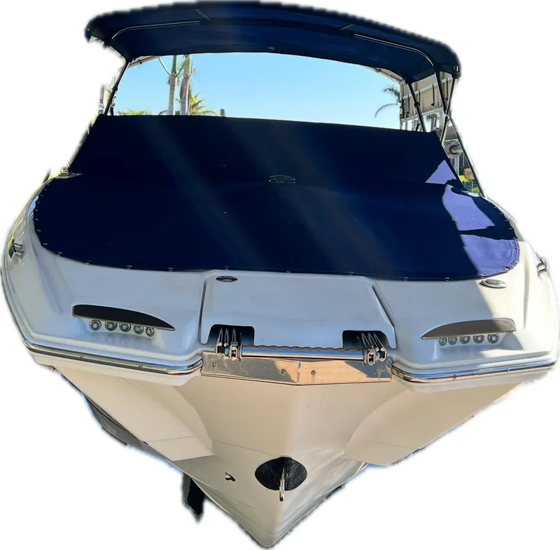 Slide: The Image of 2020 Cobalt 25SC boat with blue cover and canopy, front view. - 6