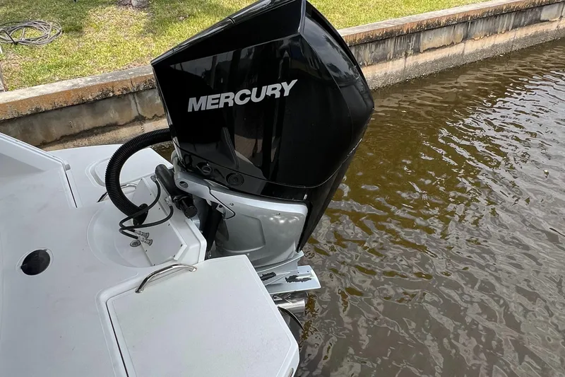 Slide: The Image of 2020 Cobalt 25SC boat with Mercury outboard motor near a canal. - 8