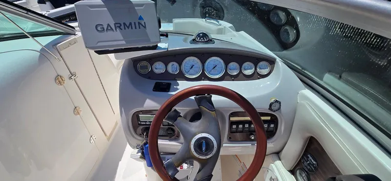 Slide: The Image of 2006 Chaparral Sunesta 254 dashboard with Garmin GPS and classic gauges. - 12