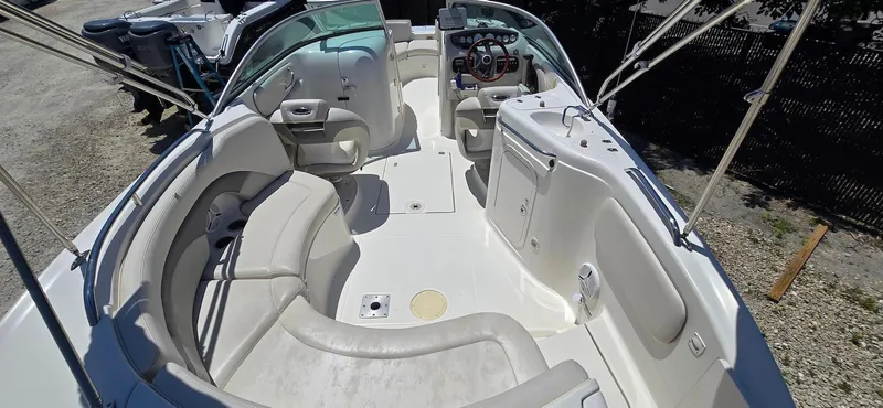 Slide: The Image of 2006 Chaparral Sunesta 254 boat interior with spacious seating and steering console. - 14