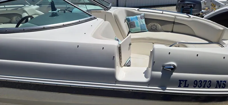 Slide: The Image of 2006 Chaparral Sunesta 254 boat with seating area and registration number FL 9373 NS. - 18