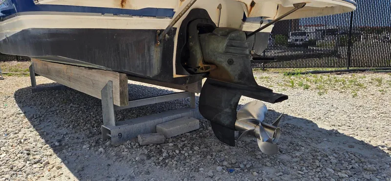 Slide: The Image of 2006 Chaparral Sunesta 254 boat on trailer, showing propeller and hull. - 28