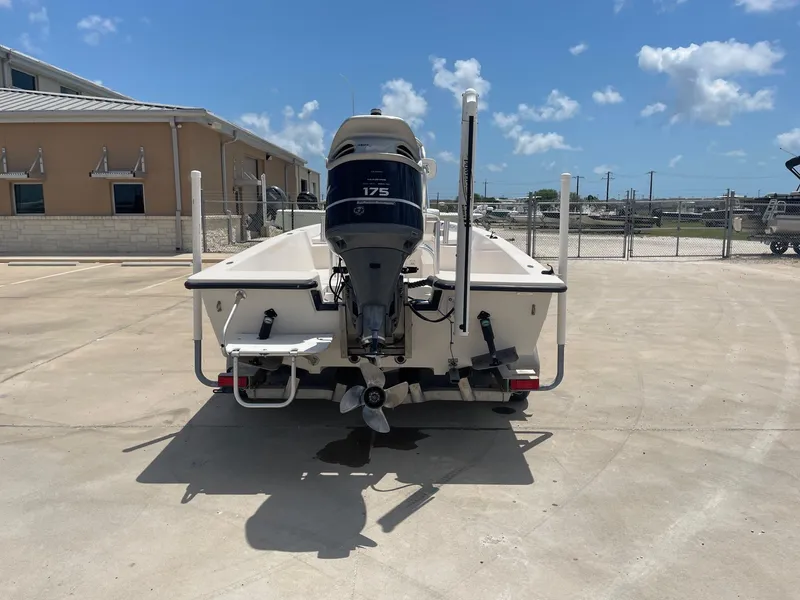 Slide: The Image of 2002 Pathfinder 2200v boat with 175 HP engine, parked outdoors on a sunny day. - 10