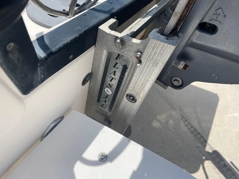 Slide: The Image of Close-up of a 2002 Pathfinder 2200v boat's Flats Jac plate and motor mount. - 13