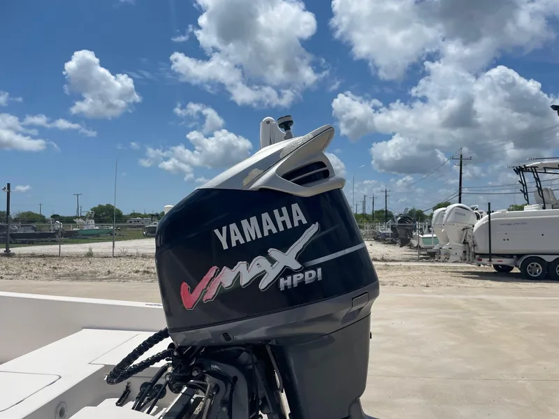 Slide: The Image of Yamaha VMAX HPDI outboard motor on a 2002 Pathfinder 2200v boat, under a partly cloudy sky. - 14
