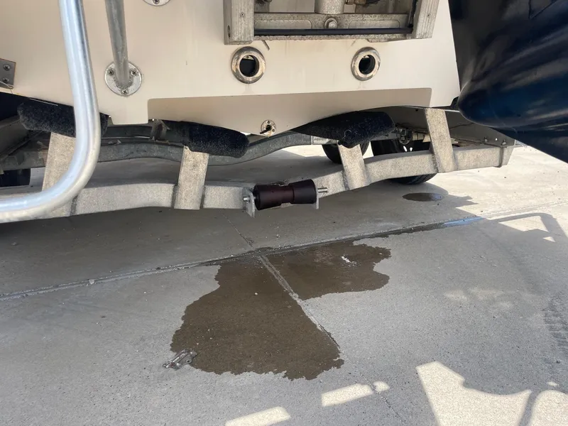 Slide: The Image of 2002 Pathfinder 2200v boat trailer with water leak on concrete surface. - 16
