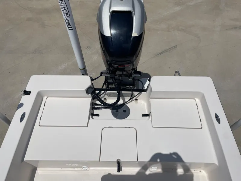 Slide: The Image of 2002 Pathfinder 2200v boat stern with motor and storage compartments. - 17