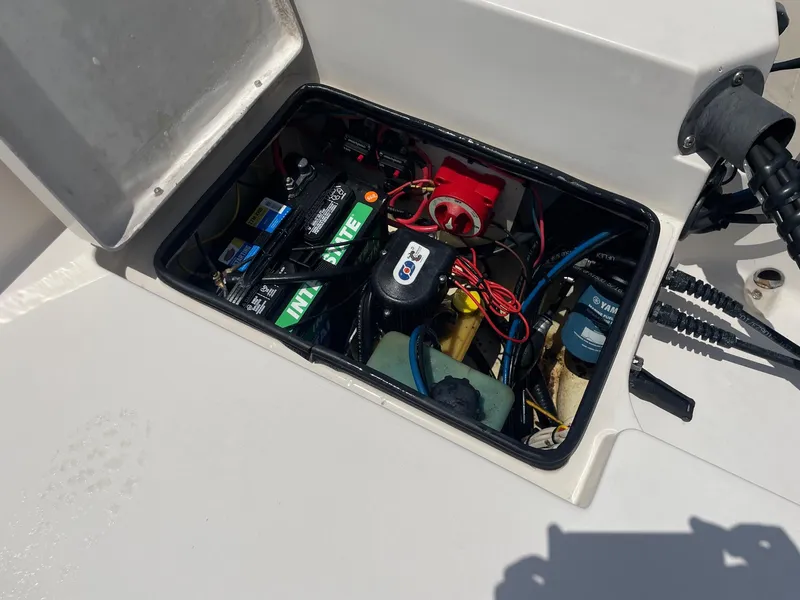 Slide: The Image of Open battery compartment of 2002 Pathfinder 2200v boat, showing wiring and components. - 20