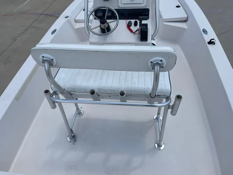 Slide: The Image of 2002 Pathfinder 2200v boat interior with steering console and seating. - 22