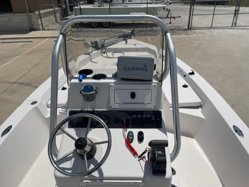 Slide: The Image of 2002 Pathfinder 2200v boat console with Garmin GPS and steering wheel. - 24