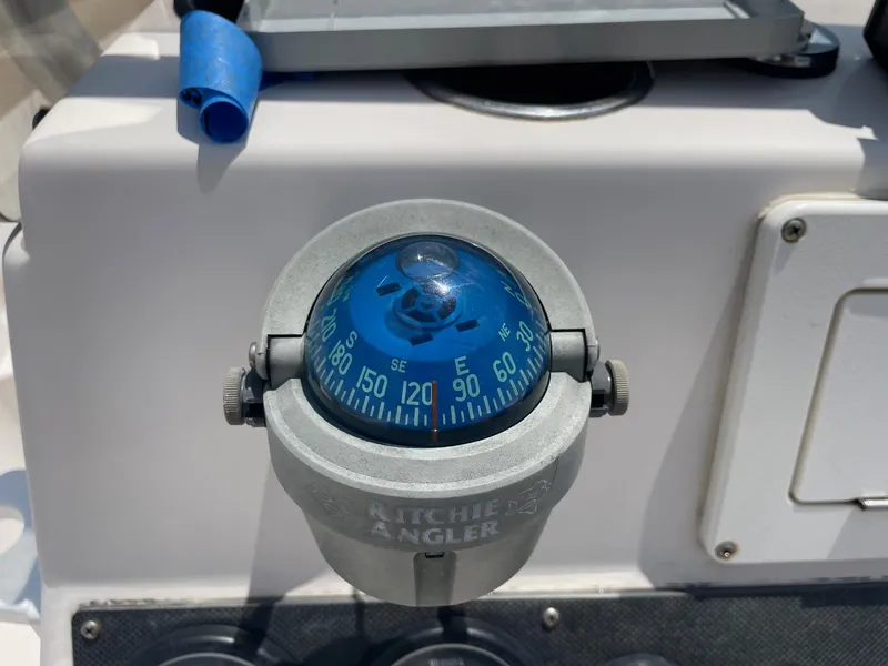 Slide: The Image of Ritchie Angler compass on 2002 Pathfinder 2200v boat dashboard. - 28