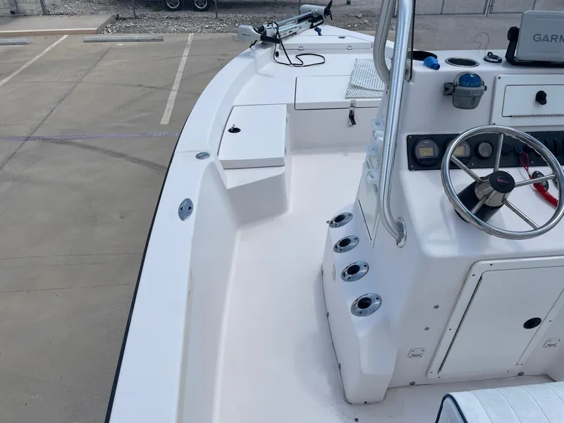 Slide: The Image of 2002 Pathfinder 2200v boat interior with steering wheel and control panel. - 34