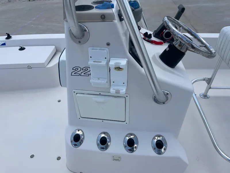 Slide: The Image of 2002 Pathfinder 2200v boat console with steering wheel and controls. - 35