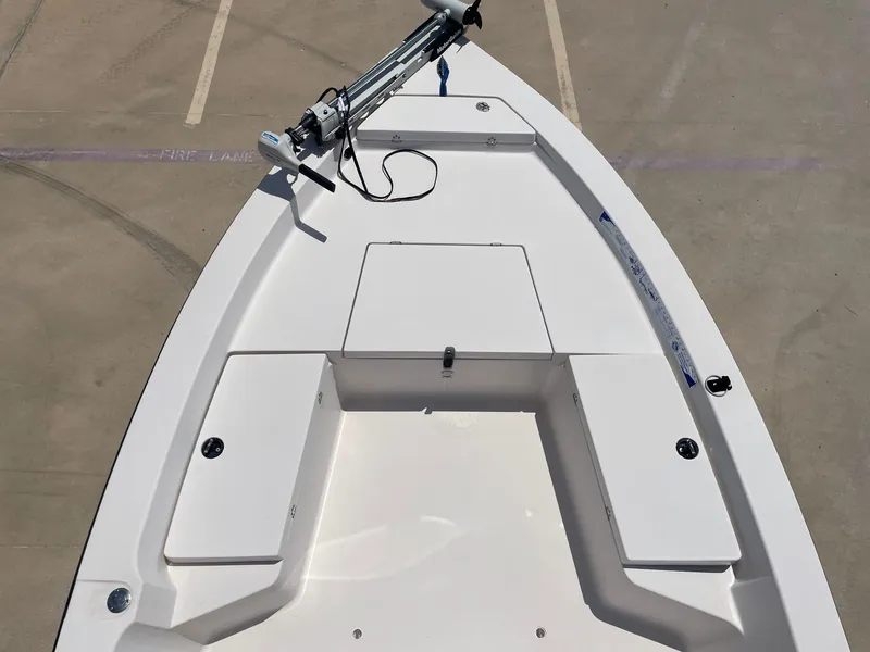 Slide: The Image of 2002 Pathfinder 2200v boat deck with storage compartments and trolling motor. - 36