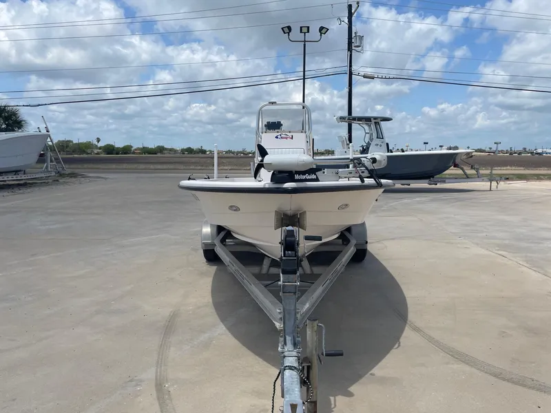Slide: The Image of 2002 Pathfinder 2200v boat on trailer under cloudy sky. - 6