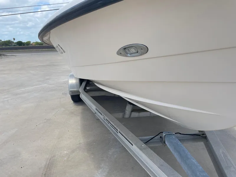 Slide: The Image of 2002 Pathfinder 2200v boat on trailer, side view, outdoors. - 7