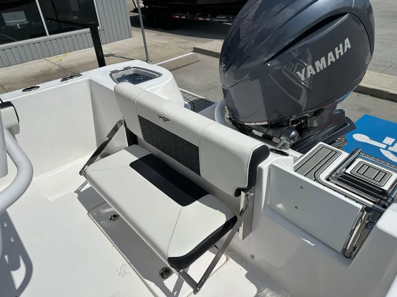 Slide: The Image of 2025 Tidewater 210CC boat with Yamaha engine, featuring a foldable rear seat. - 17