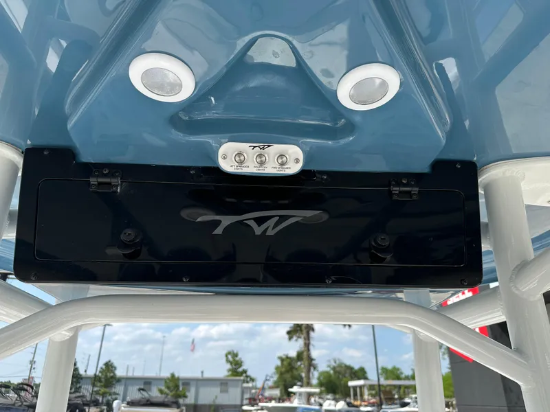 Slide: The Image of 2025 Tidewater 210CC boat console with speakers and control panel, viewed from below. - 20