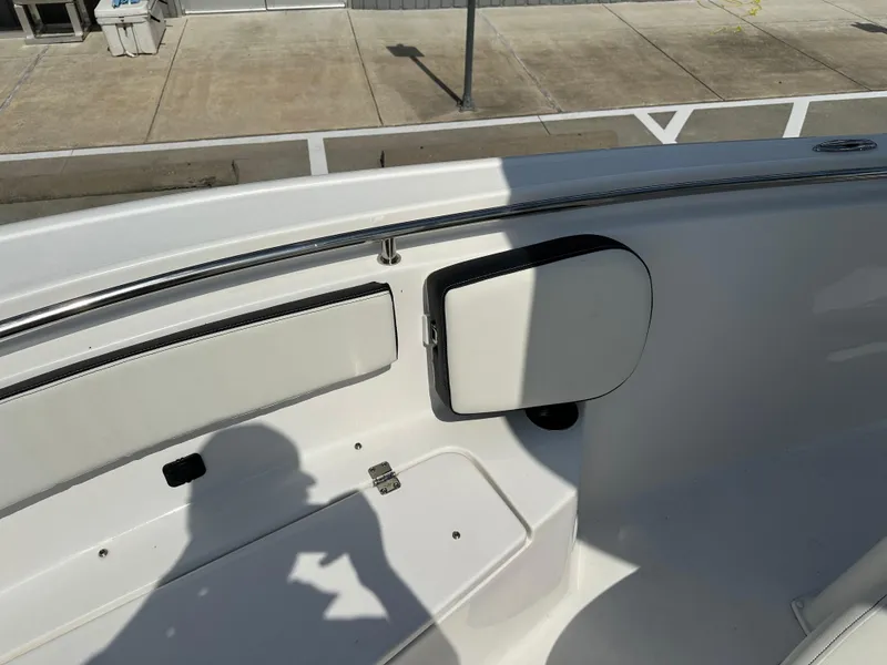 Slide: The Image of 2025 Tidewater 210CC boat interior with seating and storage compartments. - 28