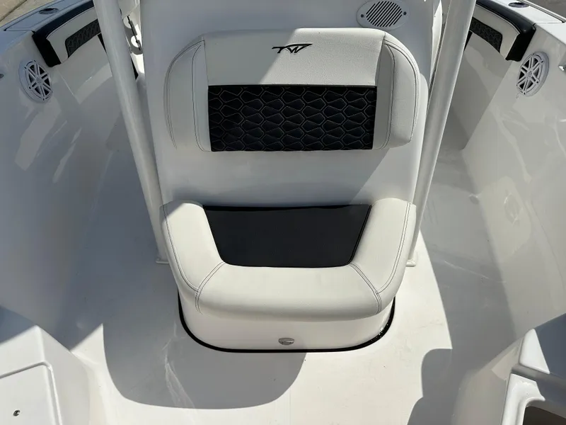 Slide: The Image of 2025 Tidewater 210CC boat seat with black and white upholstery. - 29