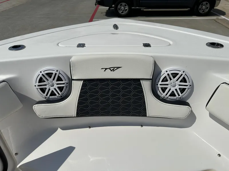Slide: The Image of 2025 Tidewater 210CC boat interior with speakers and cushioned seating. - 31