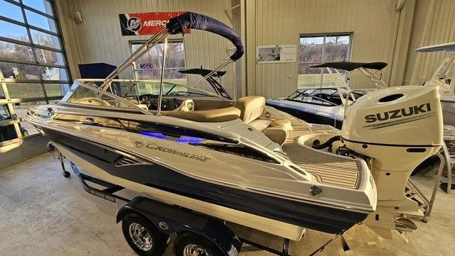 Slide: The Image of 2020 Crownline E 215 XS boat with Suzuki outboard motor in showroom. - 3