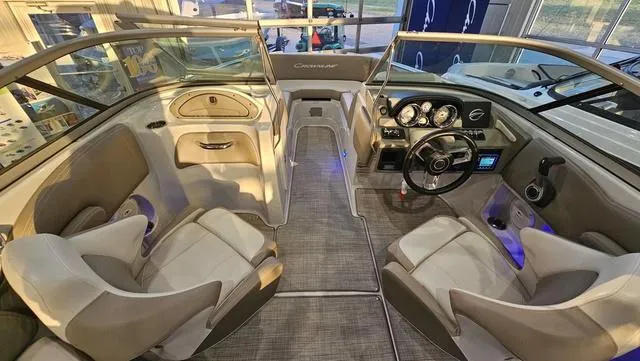 Slide: The Image of 2020 Crownline E 215 XS boat interior with modern dashboard and seating. - 18