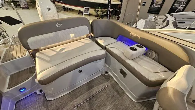 Slide: The Image of 2020 Crownline E 215 XS boat interior with plush seating and cup holders. - 11