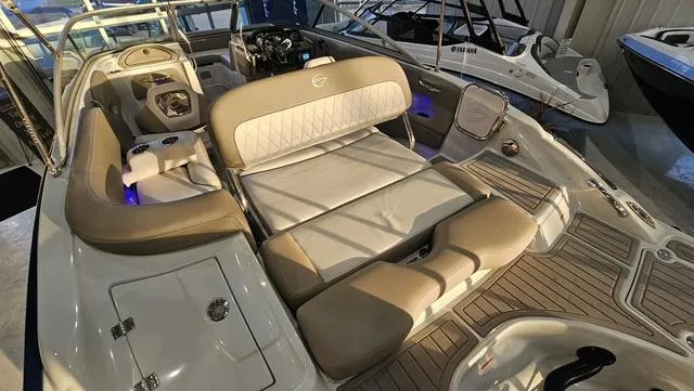 Slide: The Image of 2020 Crownline E 215 XS boat interior with beige seating and modern design. - 7