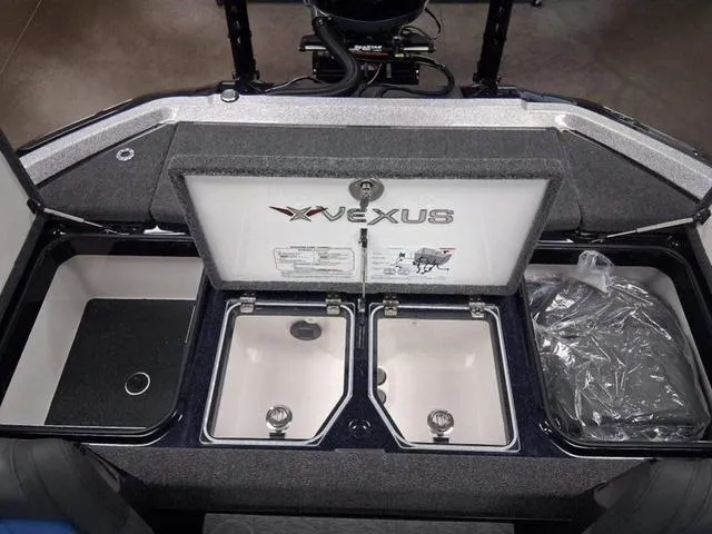 Slide: The Image of 2025 Vexus VX S20 boat storage compartments with open lids, showcasing interior design. - 13