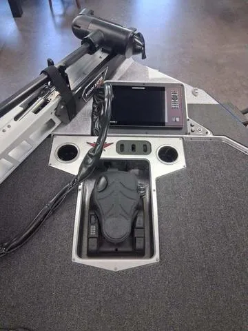 Slide: The Image of 2025 Vexus VX S20 boat dashboard with control panel and electronic display. - 4