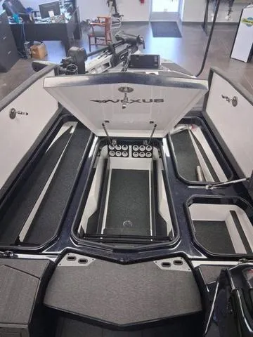 Slide: The Image of 2025 Vexus VX S20 boat interior with open storage compartments and sleek design. - 5