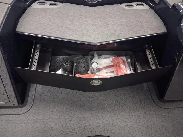 Slide: The Image of 2025 Vexus VX S20 storage compartment with various tools and accessories. - 7