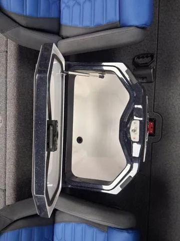 Slide: The Image of 2025 Vexus VX S20 boat storage compartment with blue seating. - 9