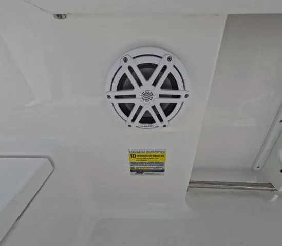 Slide: The Image of 2021 Sportsman Open 232 boat speaker and capacity label detail. - 14