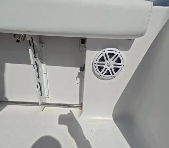 Slide: The Image of 2021 Sportsman Open 232 boat interior with speaker and storage compartment. - 15