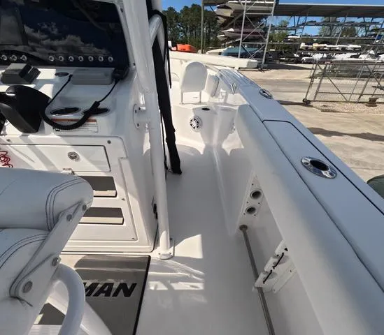 Slide: The Image of 2021 Sportsman Open 232 boat interior with console and seating, showcasing modern design. - 23
