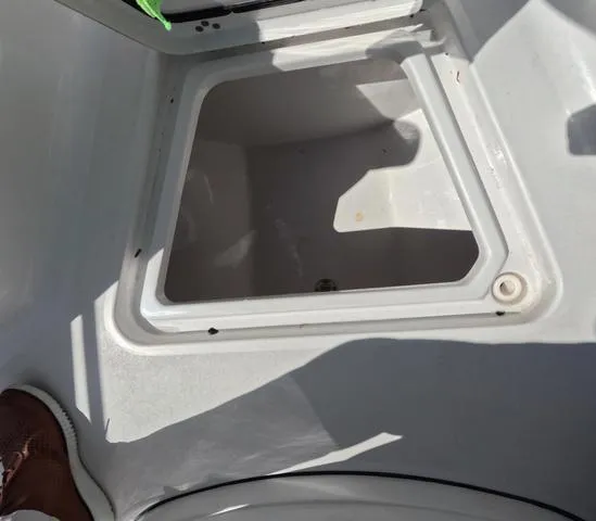 Slide: The Image of 2021 Sportsman Open 232 boat storage compartment, clean and spacious interior. - 34