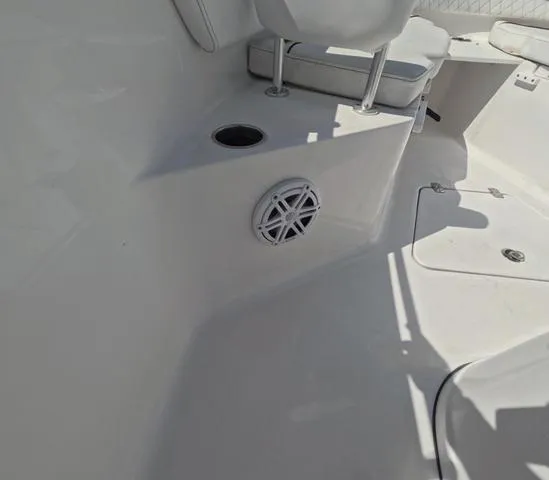 Slide: The Image of 2021 Sportsman Open 232 boat interior with seating and speaker detail. - 40