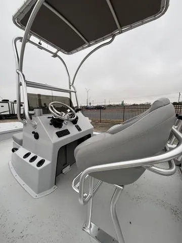 Slide: The Image of 2024 Majek M2 ILLUSION boat cockpit with steering wheel and seating. - 5